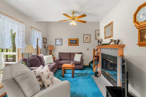 730 2Nd Street, Canmore, AB - Indoor Photo Showing Living Room With Fireplace