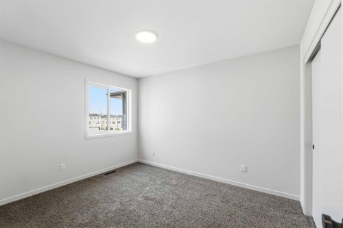 86 Heritage Heath, Cochrane, AB - Indoor Photo Showing Other Room