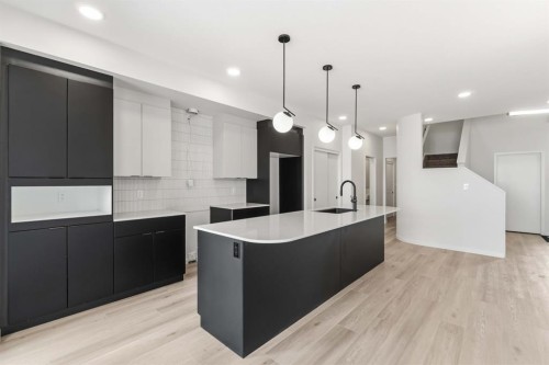 86 Heritage Heath, Cochrane, AB - Indoor Photo Showing Kitchen With Upgraded Kitchen