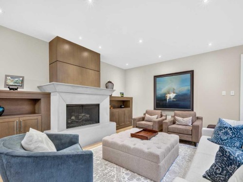 22 Aspen Ridge Square Sw, Calgary, AB - Indoor Photo Showing Living Room With Fireplace