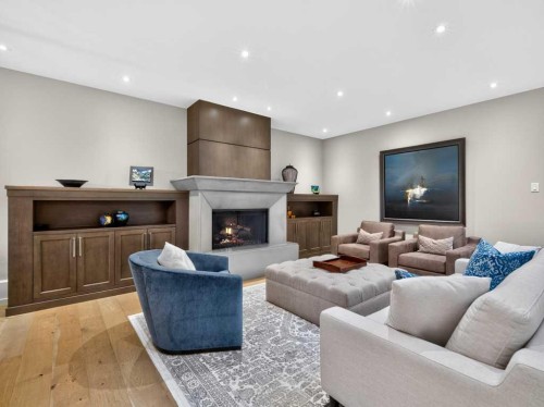 22 Aspen Ridge Square Sw, Calgary, AB - Indoor Photo Showing Living Room With Fireplace