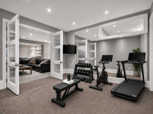 22 Aspen Ridge Square Sw, Calgary, AB - Indoor Photo Showing Gym Room