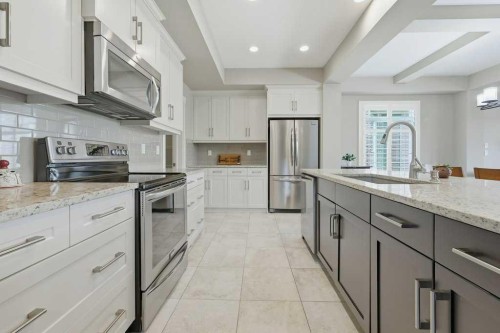 27 Jumping Pound Terrace, Cochrane, AB - Indoor Photo Showing Kitchen With Upgraded Kitchen
