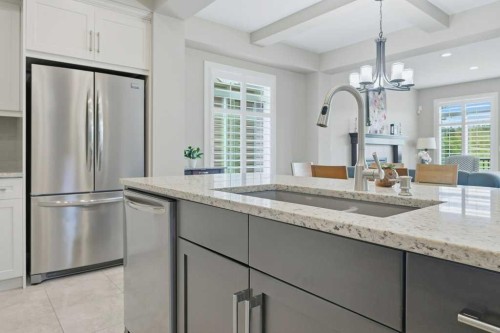 27 Jumping Pound Terrace, Cochrane, AB - Indoor Photo Showing Kitchen With Upgraded Kitchen