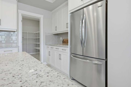 27 Jumping Pound Terrace, Cochrane, AB - Indoor Photo Showing Kitchen