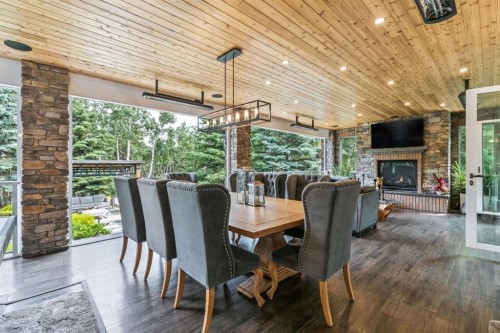 14 Pinehurst Drive, Heritage Pointe, AB -  Photo Showing Dining Room With Fireplace