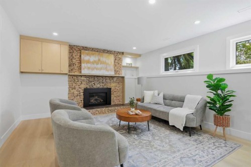 1132 Lake Sylvan Place Se, Calgary, AB - Indoor Photo Showing Living Room With Fireplace