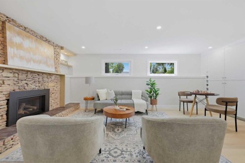 1132 Lake Sylvan Place Se, Calgary, AB - Indoor Photo Showing Living Room With Fireplace