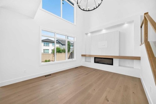 107 West Grove Gate Sw, Calgary, AB - Indoor Photo Showing Other Room With Fireplace