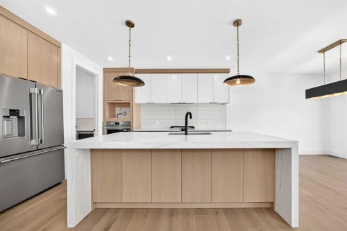 107 West Grove Gate Sw, Calgary, AB - Indoor Photo Showing Kitchen With Upgraded Kitchen