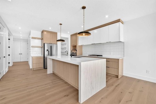 107 West Grove Gate Sw, Calgary, AB - Indoor Photo Showing Kitchen With Upgraded Kitchen