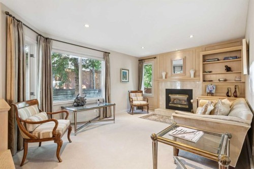 48 Patterson Mews Sw, Calgary, AB - Indoor Photo Showing Living Room With Fireplace