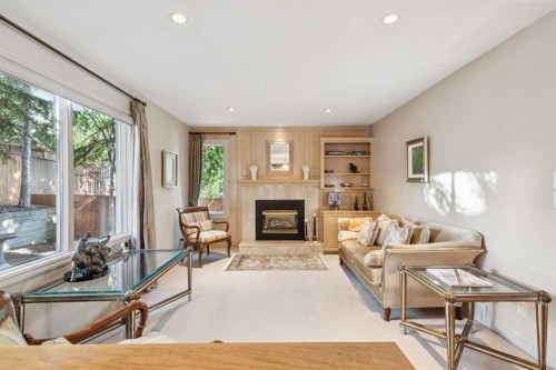 48 Patterson Mews Sw, Calgary, AB - Indoor Photo Showing Other Room With Fireplace