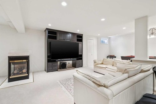 48 Patterson Mews Sw, Calgary, AB - Indoor Photo Showing Living Room With Fireplace