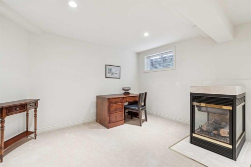 48 Patterson Mews Sw, Calgary, AB - Indoor With Fireplace