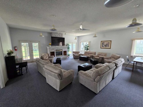 3516 26A Street Se, Calgary, AB - Indoor Photo Showing Living Room With Fireplace