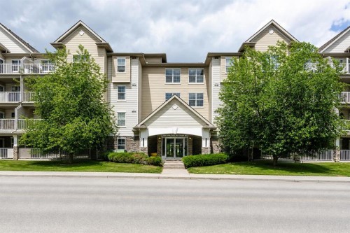 210-2000 Applevillage Court Se, Calgary, AB - Outdoor With Balcony With Facade