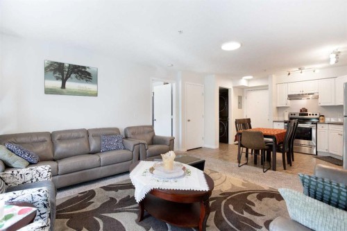 210-2000 Applevillage Court Se, Calgary, AB - Indoor Photo Showing Living Room