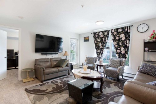 210-2000 Applevillage Court Se, Calgary, AB - Indoor Photo Showing Living Room