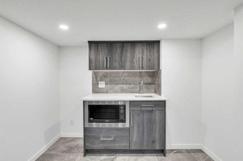 52 Edith Gate Nw, Calgary, AB - Indoor Photo Showing Other Room