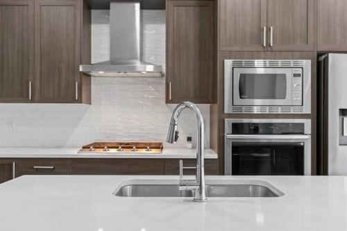 109 Mallard Grove Se, Calgary, AB - Indoor Photo Showing Kitchen With Double Sink With Upgraded Kitchen