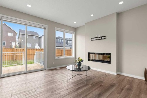 109 Mallard Grove Se, Calgary, AB - Indoor Photo Showing Living Room With Fireplace