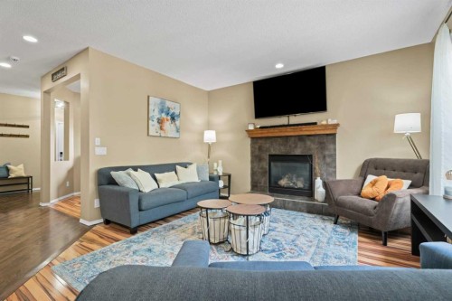 266 Cranwell Bay Se, Calgary, AB - Indoor Photo Showing Living Room With Fireplace
