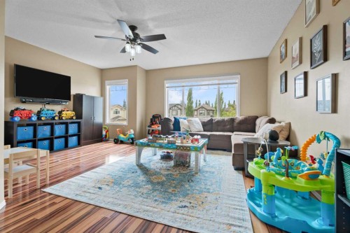 266 Cranwell Bay Se, Calgary, AB - Indoor Photo Showing Living Room