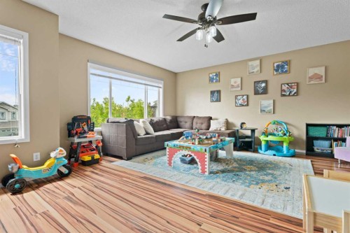 266 Cranwell Bay Se, Calgary, AB - Indoor Photo Showing Living Room