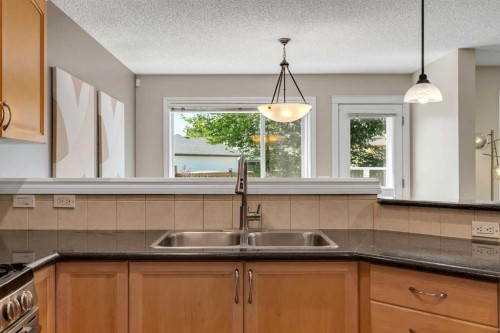 292 Coville Close Ne, Calgary, AB - Indoor Photo Showing Kitchen With Double Sink