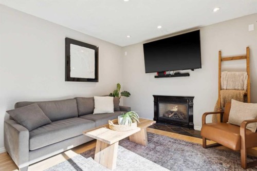16 Brenner Place Nw, Calgary, AB - Indoor Photo Showing Living Room With Fireplace