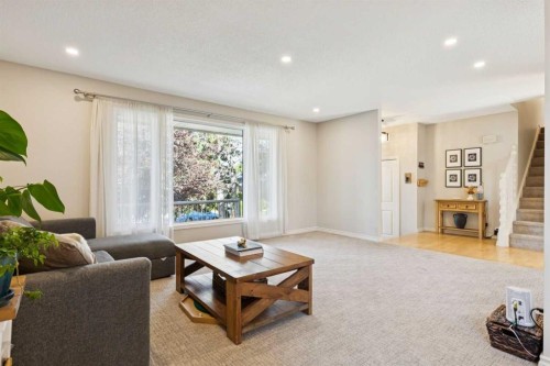 16 Brenner Place Nw, Calgary, AB - Indoor Photo Showing Living Room With Fireplace