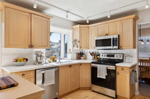 16 Brenner Place Nw, Calgary, AB - Indoor Photo Showing Kitchen With Stainless Steel Kitchen With Double Sink
