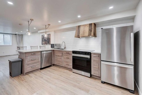1320 116 Avenue Sw, Calgary, AB - Indoor Photo Showing Kitchen With Upgraded Kitchen