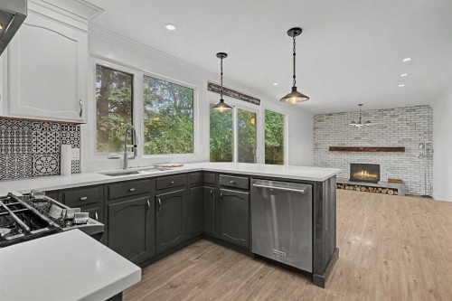 1320 116 Avenue Sw, Calgary, AB - Indoor Photo Showing Kitchen With Fireplace