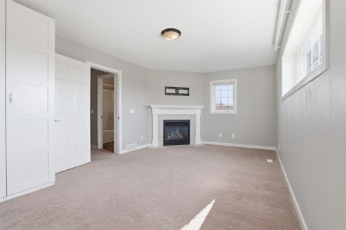 1702 Riverside Drive Nw, High River, AB - Indoor With Fireplace