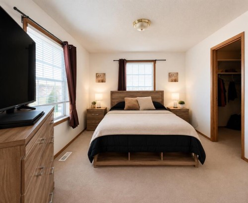 16 Canoe Close Sw, Airdrie, AB - Indoor Photo Showing Bedroom