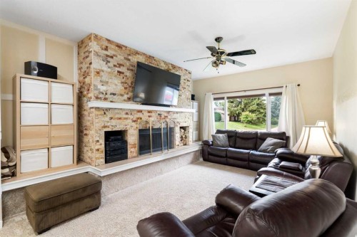 48 Deermont Way Se, Calgary, AB - Indoor Photo Showing Living Room With Fireplace