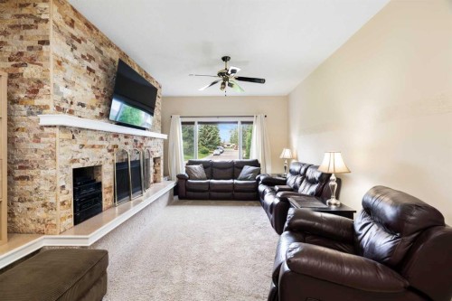 48 Deermont Way Se, Calgary, AB - Indoor Photo Showing Living Room With Fireplace