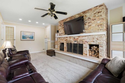 48 Deermont Way Se, Calgary, AB - Indoor Photo Showing Living Room With Fireplace