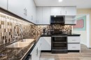 48 Deermont Way Se, Calgary, AB  - Indoor Photo Showing Kitchen With Double Sink 