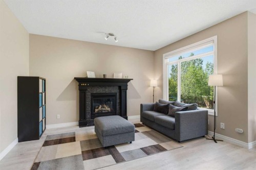331 Parkmere Green, Chestermere, AB - Indoor Photo Showing Living Room With Fireplace