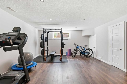 331 Parkmere Green, Chestermere, AB - Indoor Photo Showing Gym Room