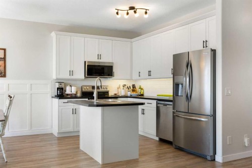590 Coopers Drive Sw, Airdrie, AB - Indoor Photo Showing Kitchen With Stainless Steel Kitchen With Upgraded Kitchen
