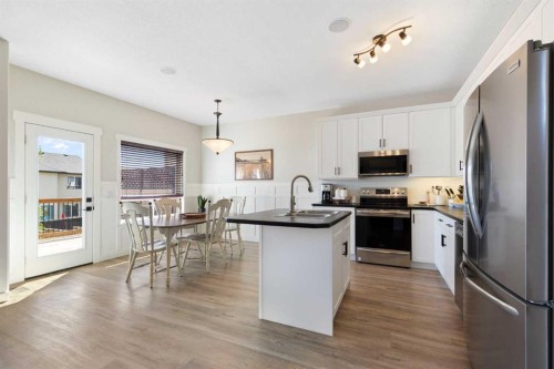 590 Coopers Drive Sw, Airdrie, AB - Indoor Photo Showing Kitchen With Stainless Steel Kitchen With Double Sink With Upgraded Kitchen