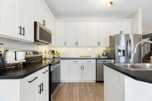 590 Coopers Drive Sw, Airdrie, AB - Indoor Photo Showing Kitchen With Stainless Steel Kitchen With Double Sink With Upgraded Kitchen