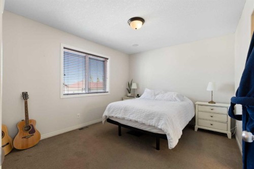 590 Coopers Drive Sw, Airdrie, AB - Indoor Photo Showing Bedroom