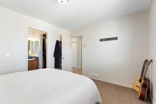 590 Coopers Drive Sw, Airdrie, AB - Indoor Photo Showing Bedroom