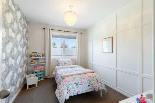 590 Coopers Drive Sw, Airdrie, AB - Indoor Photo Showing Bedroom