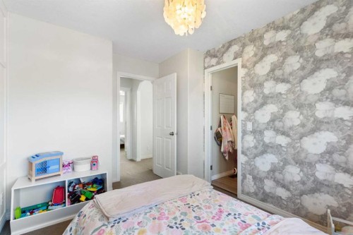 590 Coopers Drive Sw, Airdrie, AB - Indoor Photo Showing Bedroom